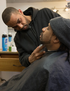 Freedom-Allah getting his beard shaped by a barber.
