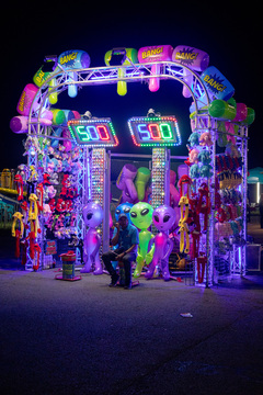 With two hours left of the NY State Fair’s operational hours, one of the game attendants sits waiting for participants to approach. After a child hit the target and read their score they got to choose from the array of prizes ranging from inflatable aliens and giant hammers to Pikachu hats.