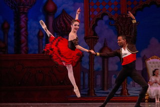 Darwin Black and Abigail Stewart dance the leads in the Hot Chocolate Divertissement movement. Black was one of Syracuse City Ballet’s guest artists who accompanied Stewart, one of the professionals that danced with the company. 