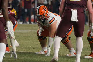 Sophomore offensive lineman Kalan Ellis sets up to defend the ball behind him. The offensive line tried to keep the Minnesota defense from preventing the Orange from scoring. 