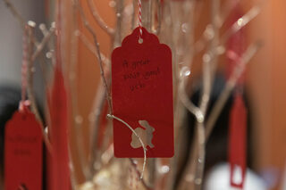 A “wishing tree” is displayed on the third level of the Schine Student Center. Attendees were encouraged to write a wish or resolution on a card and hang it from the tree or take it with them. 