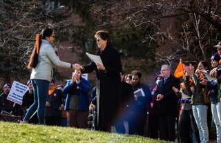 SGEU representative Sadie Novak shakes hands with Gretchen Ritter, the Vice Chancellor, Provost and Chief Academic Officer at SU. The gesture concluded a series of speeches by SGEU supporters. 