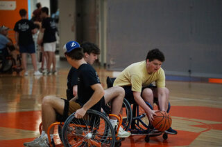 Members of fraternity Phi Kappa Psi played wheelchair basketball with community members. The fraternity partnered with MoveAlong, Inc., a group whose mission is to promote inclusive sports in the Syracuse area, in order to host OrangeAbility. 