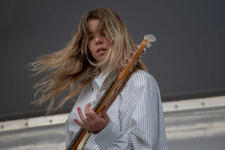 The Aces bassist McKenna Petty whips her hair back and forth as the band performs ”Girls Make Me Wanna Die,” one of the songs on their newest EP ”I’ve Loved You For So Long.”  Petty was the first member of the group to join sisters Cristal and Alisa Ramirez and create the band, originally called The Blue Aces.