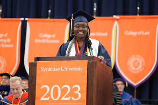 Chelsea Brown, one of the 2023 University Scholars, speaks to her fellow graduating students at the ceremony. In her speech, she reflected on what SU meant to her, past and present. 