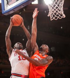 Rakeem Christmas blocks a shot by the Red Storm's Sir'Dominic Pointer in the paint.