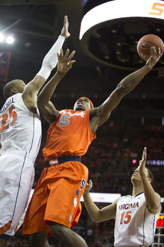 C.J. Fair goes up for a layup with Mitchell contesting. 