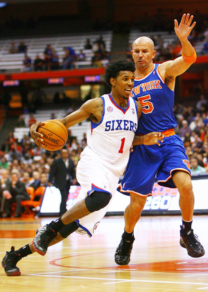 Philadelphia 76ers guard Nick Young drives against New York Knicks guard Jason Kidd during  the 76ers' 98-90 win in an exhibition game at the Carrier Dome on Monday night.