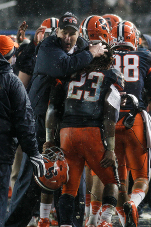 Head coach Doug Marrone meets Prince-Tyson Gulley at the sideline in Syracuse's 38-14 win over West Virginia. Marrone sits at 25-25 through four seasons as SU head coach.