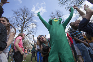 Chloe Rodabaugh, a junior musical theater major, dances with Connor Deroin, a sophomore political science major, dressed in a Gumby costume.