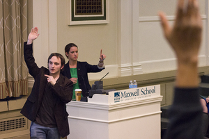 Ben Jones, SA parliamentarian, and Allie Curtis, SA president, count votes at the assembly meeting Monday night. SA passed a bill altering presidential election procedures and approved a resolution calling for SU Athletics to pay the Big East exit fee.