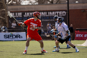 Scott Loy and the Orange upset Johns Hopkins despite struggling at the faceoff X.