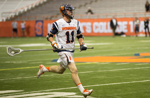 Brandon Mullins cradles the ball during SU's 10-9 upset loss to Bryant in the first round of the NCAA tournament Sunday night.