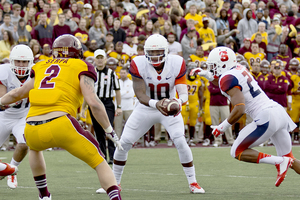 Terrel Hunt works with Prince-Tyson Gulley in Syracuse's zone read offense in a 40-3 win over Central Michigan on Saturday. 