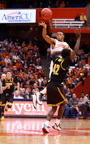 Syracuse guard Ron Patterson throws a pass to his right. The sophomore saw some time at point guard Friday night with Michael Gbinije sidelined.