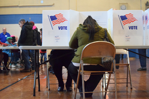 Members of the Syracuse community cast their votes on Election Day. Syracuse University students had the option to ride a free bus to polling stations on or near the SU campus.