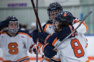 Grossi (8), pictured here on Nov. 10, moved to the top of SU's all-time scoring list Saturday with an assist against Rochester Institute of Technology.