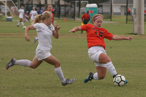 Erin King lunges for a ball in a game. She is returning from a torn ACL last year.