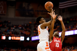 Tyus Battle is contested by Cornell's Matt Morgan on a shot attempt. Each player led their teams with 26 points.