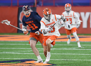 Brendan Curry sprints down the field on a break against No. 2 Virginia. Curry finished with three goals and four assists in the Orange's dominant 20-10 win over the Cavaliers. 