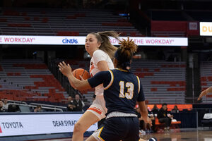 Georgia Woolley led all scorers with a season-high 23 points, but the Orange saw a nine-point fourth-quarter lead dwindle away.