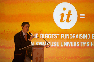 Dylan Lustig, Student Association president, speaks under a tent on the Quad Thursday. SU announced it surpassed its $1 billion goal in the Campaign for Syracuse University.