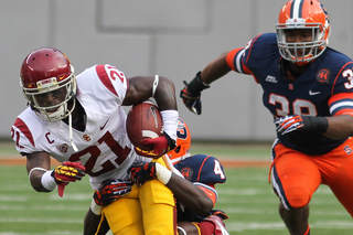 USC Trojans cornerback Nickell Robey #21 tries to break free on a hand off.