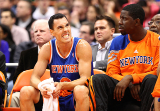 Pablo Prigoni of the New York Knicks cringes as he sits on the bench during the preseason game against the Philadelphia 76ers at the Carrier Dome.