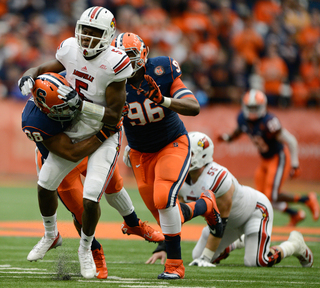 Linebacker Cameron Lynch plows into quarterback Teddy Bridgewater in SU's 45-26 win.