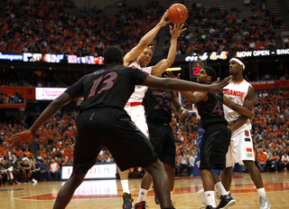 Syracuse guard Brandon Triche looks to pass the ball in the second half.