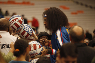 Moose signs autographs for the fans following Friday's championship game, a 114-100 win for the Globetrotters. 