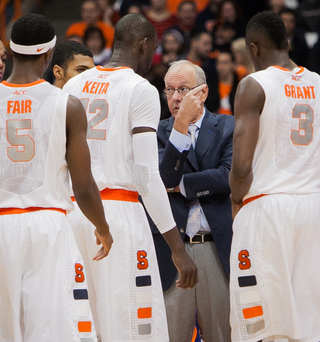 Syracuse head coach Jim Boeheim talks to Keita and Co. during a timeout. 