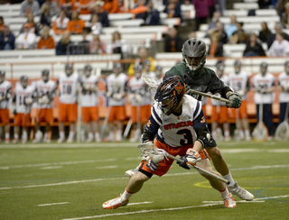 SU senior midfielder Billy Ward dodges with a Binghamton defender breathing down his neck. 