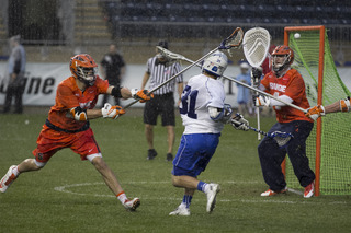 Bobby Wardwell does his best to save a Jordan Wolf shot that finds the top of the cage.  