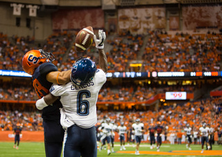 SU wide receiver Jarrod West and Villanova defensive back Jason Ceneus vie for a deep ball. 