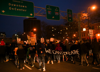 Students march downtown as  a part of the 