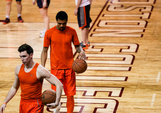 Syracuse forward Michael Gbinije dribbles during pregame warm-ups.