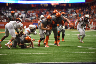 Dungey runs on one of his 24 scampers. The quarterback hurt his knee but battled through the injury on several of his called runs. 