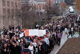 Syracuse University joined more than 80 colleges and universities in walking out of classes and protesting president-elect Donald's rhetoric during his campaign, specifically on immigration.