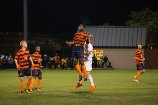 Miller goes up for a header.