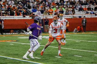 Peter Dearth defends an Albany player.